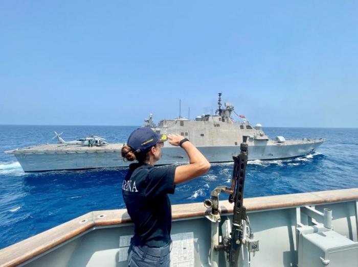 ITS RIZZO Commanding Officer saluting USS INDIANAPOLIS