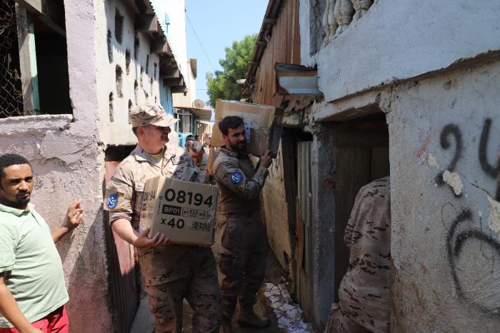 EUNAVFOR crewmembers delivering basic school kits to the “Baraka” association